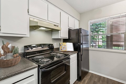 our apartments offer a modern kitchen with stainless steel appliances at Acacia Gardens, Albuquerque, NM, 87111